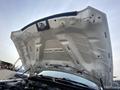 The underside of the hood of a 2016 RAM 5500 showing the struts and insulation panel