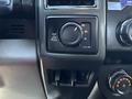 Control panel of a 2022 Ford F-350 SD featuring a four-wheel drive selector knob and various switches for vehicle settings