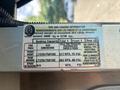A 2012 Ford E-450 tire and loading information label detailing seating capacity tire specifications and pressure recommendations