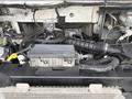 The image shows the engine compartment of a 2018 Ford E-450 highlighting various components including the air intake and electrical connections