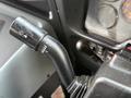 Close-up of the windshield wiper control lever in a 2013 International 4300 featuring different settings for wiper speed