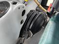 The image shows the control panel of a 2009 New Holland T4020 tractor featuring various knobs and gauges for operation settings