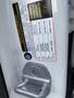 A 2014 Mercedes-Benz CLA-Class car door latch with a manufacturer label detailing specifications and information