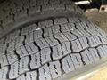 Close-up view of a worn tire tread of a 2017 Freightliner MT45 displaying distinct patterns and grooves designed for traction and stability