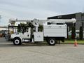 A white 2011 International 4300 bucket truck with a mounted aerial lift arm extended from the top for utility work