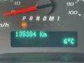 A close-up of a vehicle's dashboard displaying a mileage of 135384 km and a temperature reading of 6°C