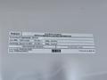 2023 Ford F-250 with a label detailing vehicle emission control information and fuel type