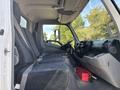 Interior of a 2018 Hino 195 truck showing the driver's seat and passenger seat with seat belts and a simple dashboard layout