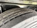 Close-up of a worn tire on a 2019 Ford F-750 showing tread patterns and surface details