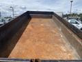 2009 Load 16 foot Dump Trailer with a rusted interior and sturdy metal sides