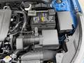 Under the hood of a 2021 Kia Forte showcasing the engine components including the battery air intake and various electrical connections