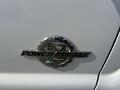 Close-up of the Power Stroke emblem on a 2014 Ford F-250 SD showcasing the turbo diesel engine branding