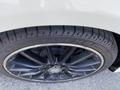 Close-up of a black alloy wheel of a 2014 Mercedes-Benz CLA-Class with a low-profile tire showing tread patterns