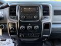 Interior dashboard of a 2016 RAM 5500 featuring a central touchscreen display and various control buttons and knobs for climate and audio settings