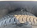 Close-up of a tire on a 2017 Chevrolet Silverado 1500 showcasing the tread pattern and sidewall details