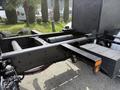 A 2016 Freightliner 108SD chassis showing the rear axle suspension and mounting points for various components