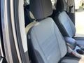 Interior of a 2016 Ford Escape featuring two front seats with gray upholstery and a center console