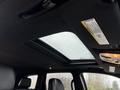 Interior view of a 2019 Jeep Grand Cherokee showcasing the panoramic sunroof and ceiling features