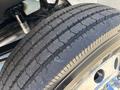 Close-up of a tire from a 2008 International DuraStar showcasing detailed tread patterns and a metallic rim