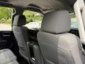 A 2018 Chevrolet Silverado 1500 interior showing the backs of two front seats with headrests and a center console in between