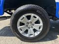 A silver alloy wheel of a 2017 Chevrolet Colorado with a BFGoodrich tire displaying the brand name and model designation