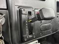 Close-up of the gear shift lever in a 2020 International MV607 displaying the gear positions R N D 4 2 1