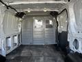 Interior view of a 2017 Ford Transit van showing empty cargo space with metal walls and flooring without any cargo or furniture
