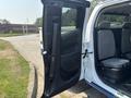 A 2017 Chevrolet Colorado with the driver's side door open revealing the interior seating and cabin features