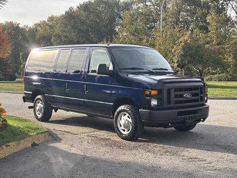 A blue 2013 Ford E-350 Super Duty van parked with a sleek exterior and large wheels