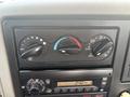 Control panel of a 2012 International 7300 Workstar featuring temperature dials fan speed controls and radio display