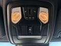 Overhead control panel in a 2021 RAM 5500 featuring switches for lights and doors with orange lights illuminated