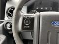 Interior view of a 2015 Ford F-350 SD steering wheel with control buttons for setting and information display visible