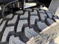 Close-up of a tire tread on a 2009 International 3000 CE showing deep grooves and rugged design for traction and durability