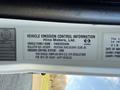 Label of a 2015 Hino 358 truck displaying vehicle emission control information and vehicle specifications