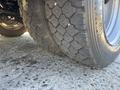 Close-up of a heavily treaded tire from a 2016 Isuzu NPR-HD showing detailed patterns and wear on the rubber surface