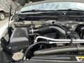 Engine compartment of a 2015 RAM 2500 featuring a black air intake and various mechanical components with visible hoses and wires