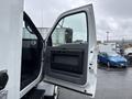 A 2011 Ford F-650 truck with an open driver's side door showing the interior and door panel