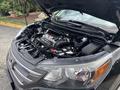 A 2014 Honda CR-V with the hood open showing the engine and components like the battery and cables in a neatly organized layout