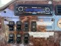 Dashboard of a 2007 International 9200i featuring a Panasonic radio and various control switches including cruise control and weight capacity information