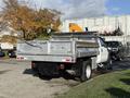 A 2008 Ford F-550 with a flatbed truck design featuring a silver metallic finish and a sturdy rear loading area