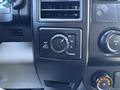 Close-up of the control panel of a 2019 Ford F-150 featuring buttons for 2H 4H 4L and a volume knob