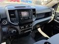 Dashboard of a 2020 Ram 2500 showing controls for audio and climate along with a touchscreen display and gear shift