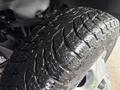 Close-up of a tire tread on a Chevrolet Silverado 3500HD showcasing deep grooves and patterns indicating rugged terrain compatibility