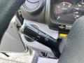 A close-up view of the control stalk in a 2018 Hino 195 featuring turn signal and headlight controls with various symbols displayed on the handle