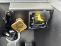 Control panel of a 2006 E-One Typhoon featuring buttons for system park and pump power with a shift transmission control and a manual mode selector