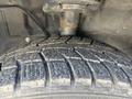 Close-up view of a worn tire tread on a 2016 Ford Transit 150 showcasing detailed grooves and patterns of the tire surface