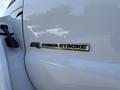 Close-up of a 2018 Ford F-750 badge featuring the text 67L Power Stroke Turbo Diesel