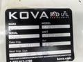 A close-up view of a label affixed to a white surface, featuring details about a 2009 Ford Econoline including make model serial and inspection dates