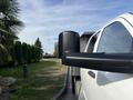 A 2013 RAM 5500 truck with a large black side mirror visible in the foreground