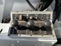 Control panel for an Altec Industries 2013 International 7500 featuring joysticks for boom functions and operational controls